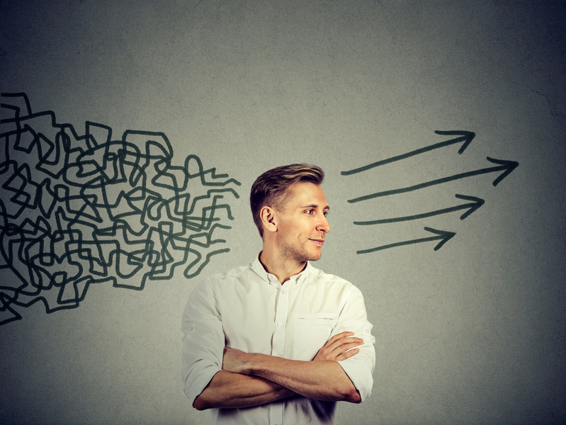 Side profile young man looking at his side getting his thought together isolated on gray wall background